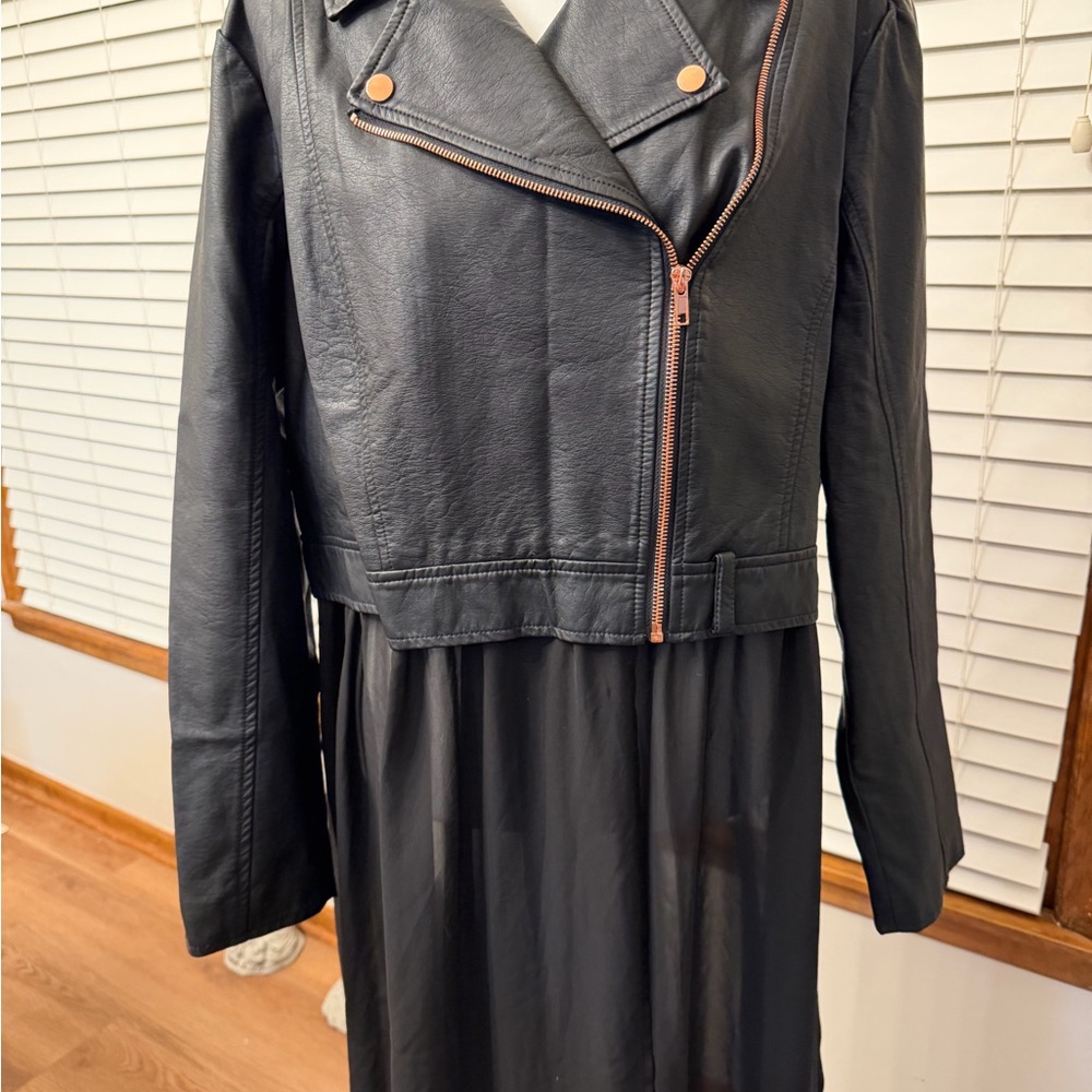Cool, Black Pleather Women's Jacket with rose gold metal zipper and grommets.